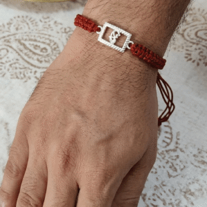 Rajyan jeweller pure silver krishna flute rakhi with red thread
