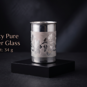 Fancy Pure Silver Glass (34g) with intricate traditional floral engraving displayed on a luxury black display stand