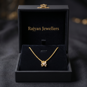 18K yellow gold butterfly pendant and 16 inch chain product specification by Rajyan Jewellers on black background