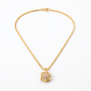Close-up of the intricate geometric hexagonal star pendant with sparkling Signity CZ stones in 18k gold by Rajyan Jewellers