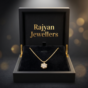 18ct yellow gold hexagonal pendant and matching chain set with Signity CZ stones on black fabric by Rajyan Jewellers