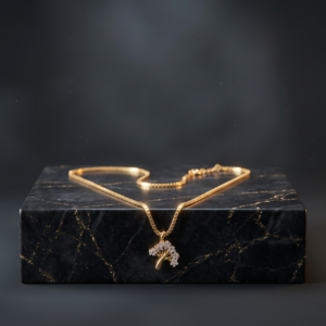 Close-up of Rajyan Jewellers 1cm tree-shaped pendant in 18K yellow gold