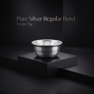 Pure silver regular bowl with dual horizontal engraved bands weighing 31 grams displayed on a matte black display stand