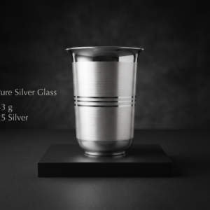 A handcrafted 925 pure silver glass weighing 43g, featuring a dual-finish brushed and polished metallic body with three decorative horizontal stripes, displayed on a matte black luxury display stand in a dark studio setting