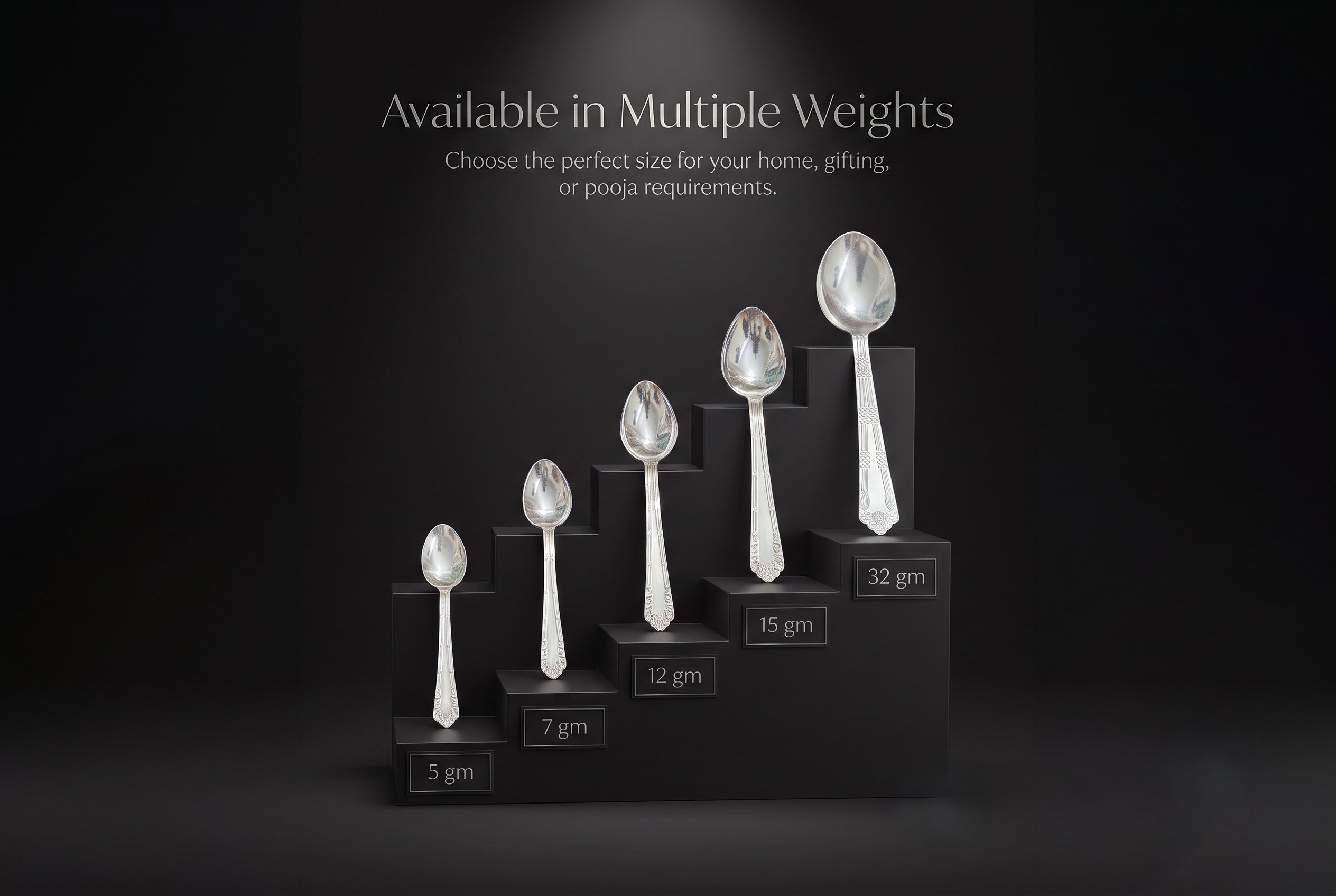 silver-spoon-all-sizes Handcrafted pure silver spoons displayed on a black staircase platform in 5g, 7g, 12g, 15g, and 32g weight variants